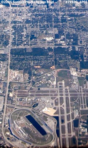 2005 - Daytona International Airport and Speedway in bottom half aerial stock photo #7192C
