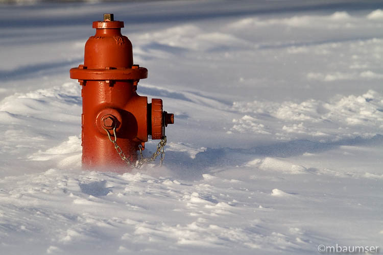 Red Hydrant In The Snow
