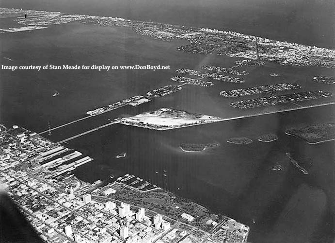 1950s - aerial view looking northeast over downtown Miami, Biscayne Bay and Miami Beach