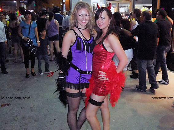 Two pretty ladies posing in their Halloween finest