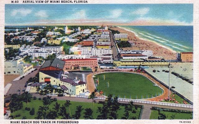 Late 1930s - aerial view of Miami Beach with the Miami Beach dog track in foreground