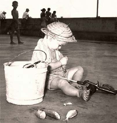 1957 - Robert Bowman doing what he likes best on the South Beach fishing pier