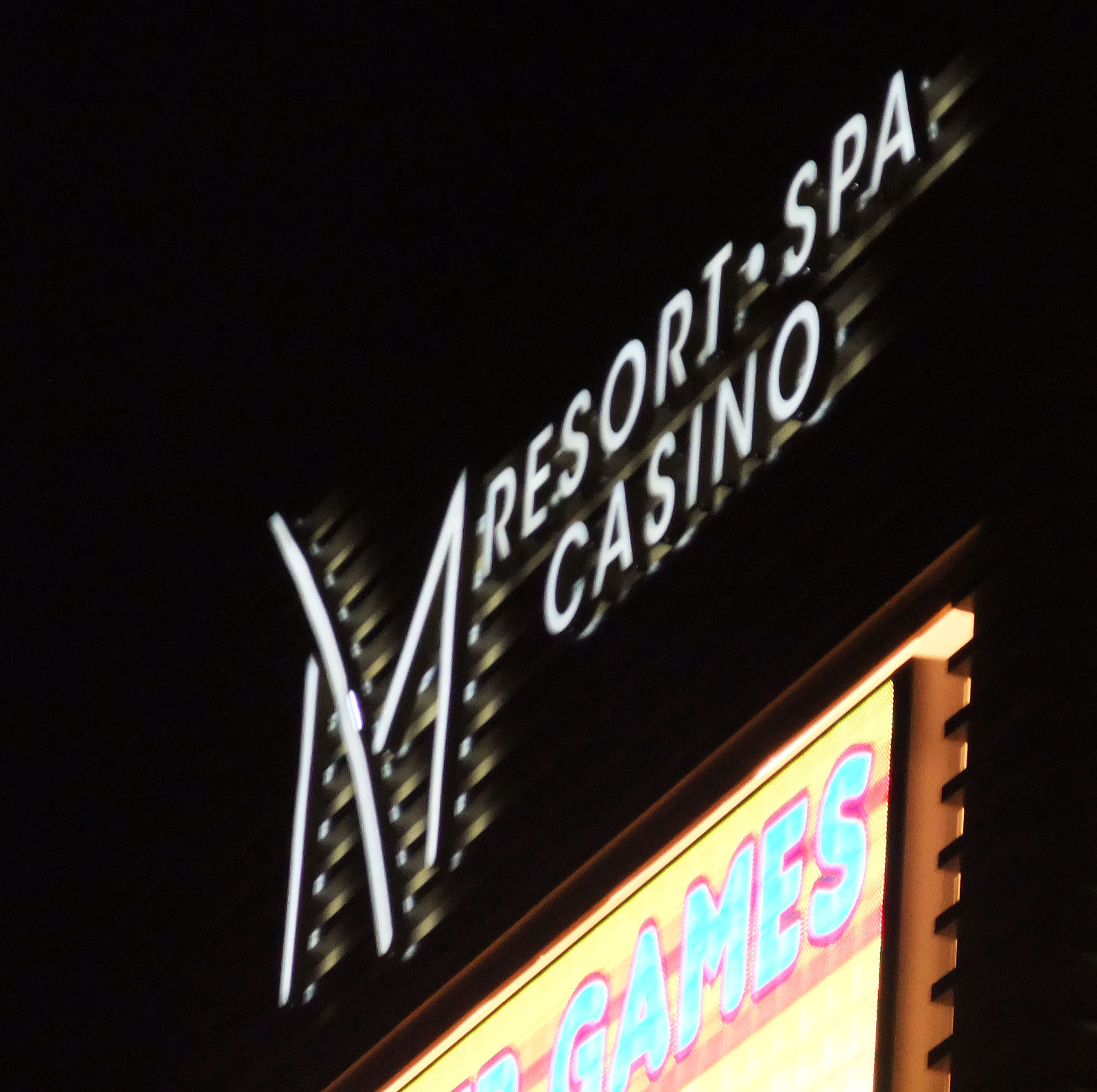 M sign at night