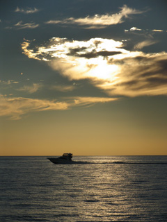 Boat at sunset off Sorrento Beach Western Australia