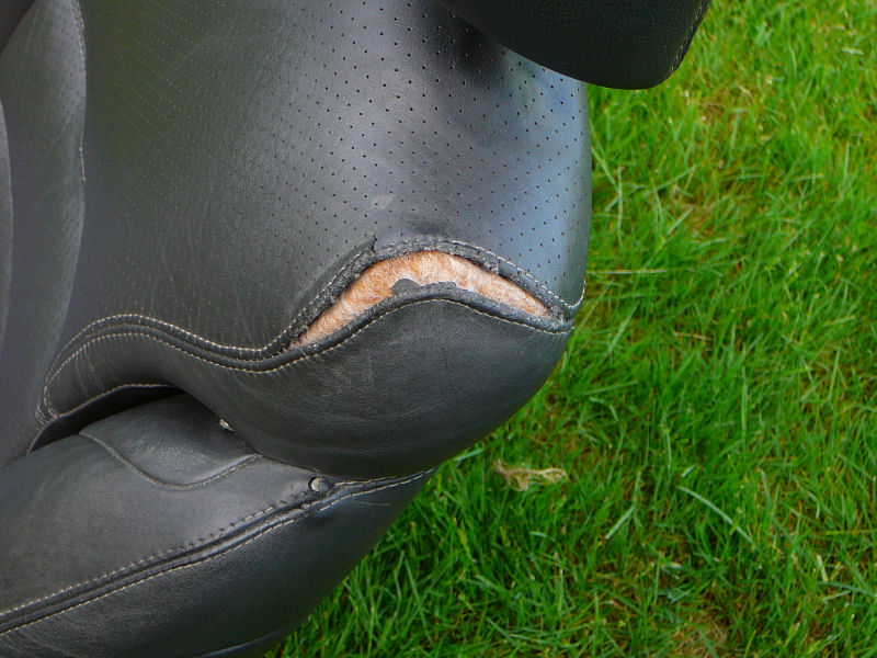 92 Lebaron Driver Side Leather Seat - Panels seperated near head rest.