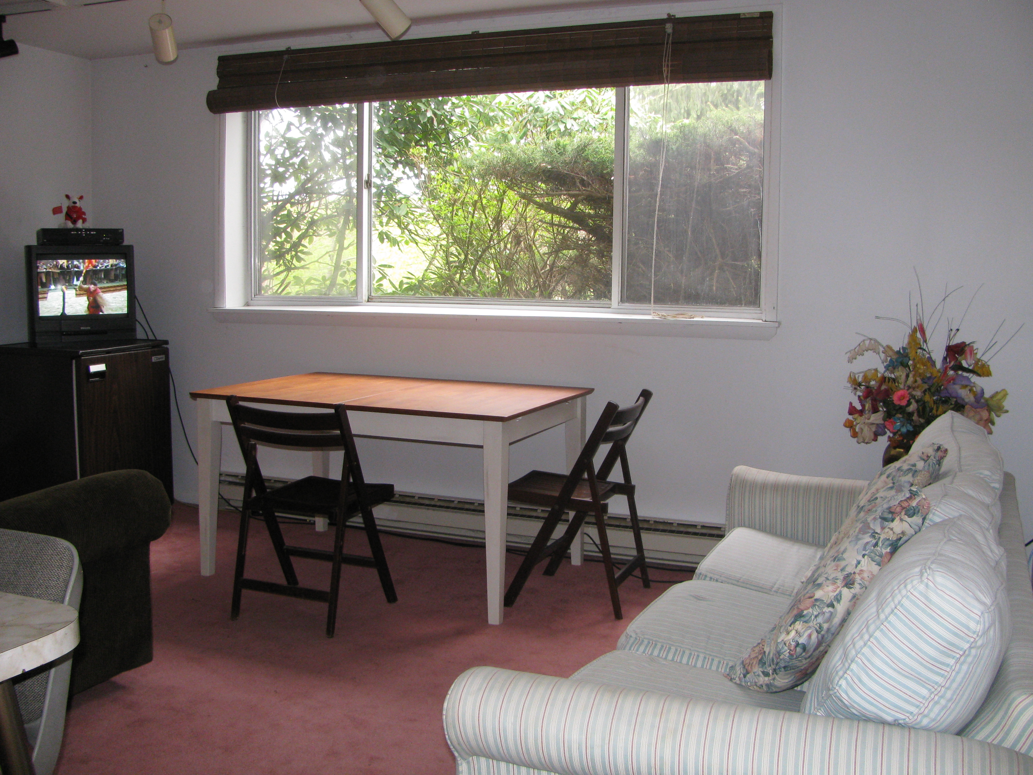 Living room with Sofa against wall.JPG