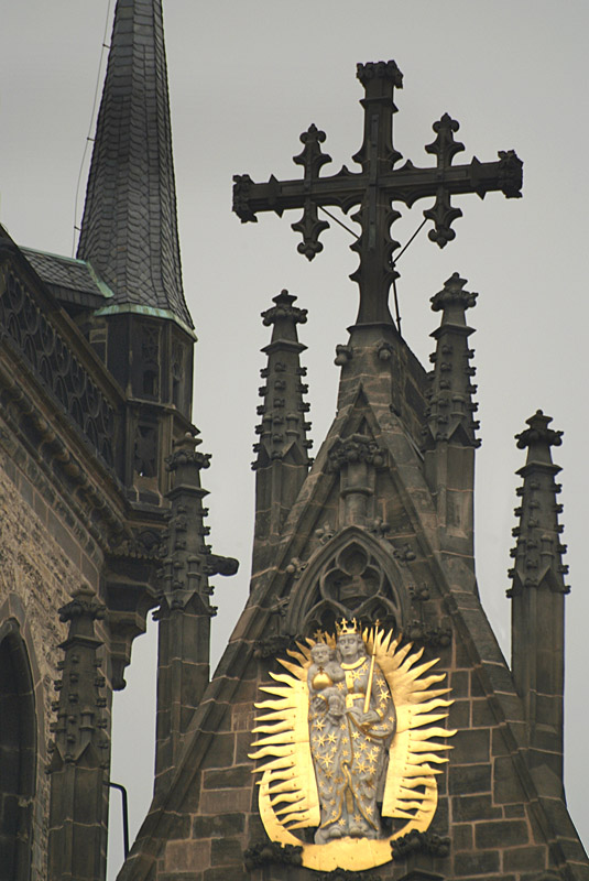 Cross and Golden Figures on Church Roof Old Town Square