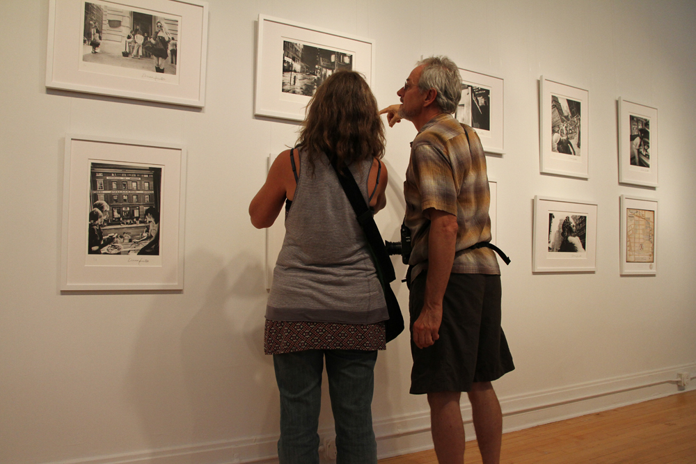 Nick Nichols and friend view Donna Ferratos exhibit at McGuffey Art Center