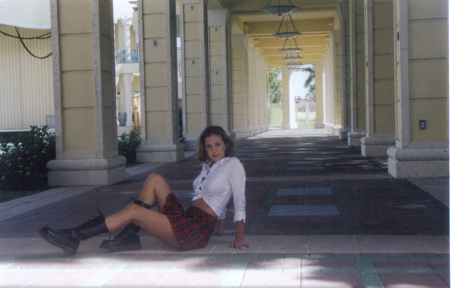 Briana in school girl pose