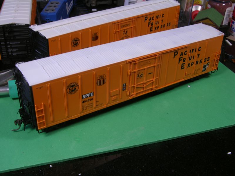 Overall view of 70s era updates to the Red Caboose R-70-15.  An unmodified car is also shown in the center background.