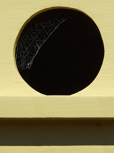 Yellow Birdhouse with Web