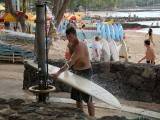 Rinsing off the surf board
