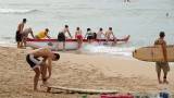 Getting the outrigger into the water, 2