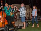 Presenting a lei to the 20th-anniversary couple