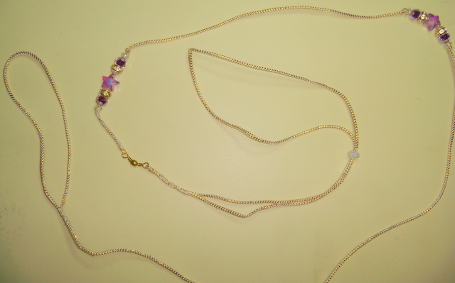 Lead 23 -Gold and White cord with purple star beads