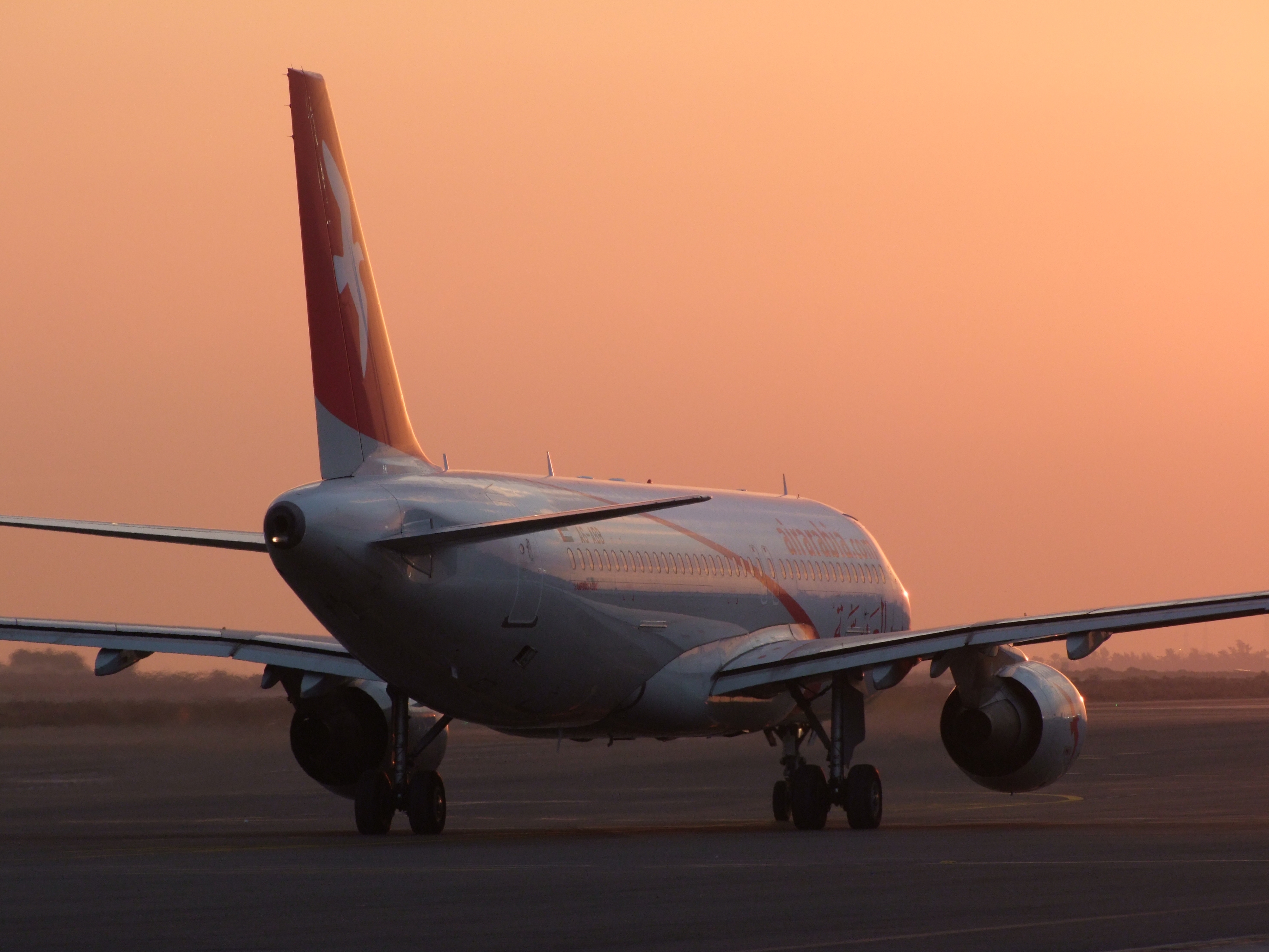 0712 17th December 08 Air Arabia A320 departure from Sharjah at Sunrise.jpg