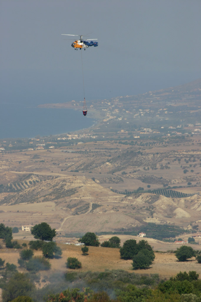 One of the helicopters with Polis in the background