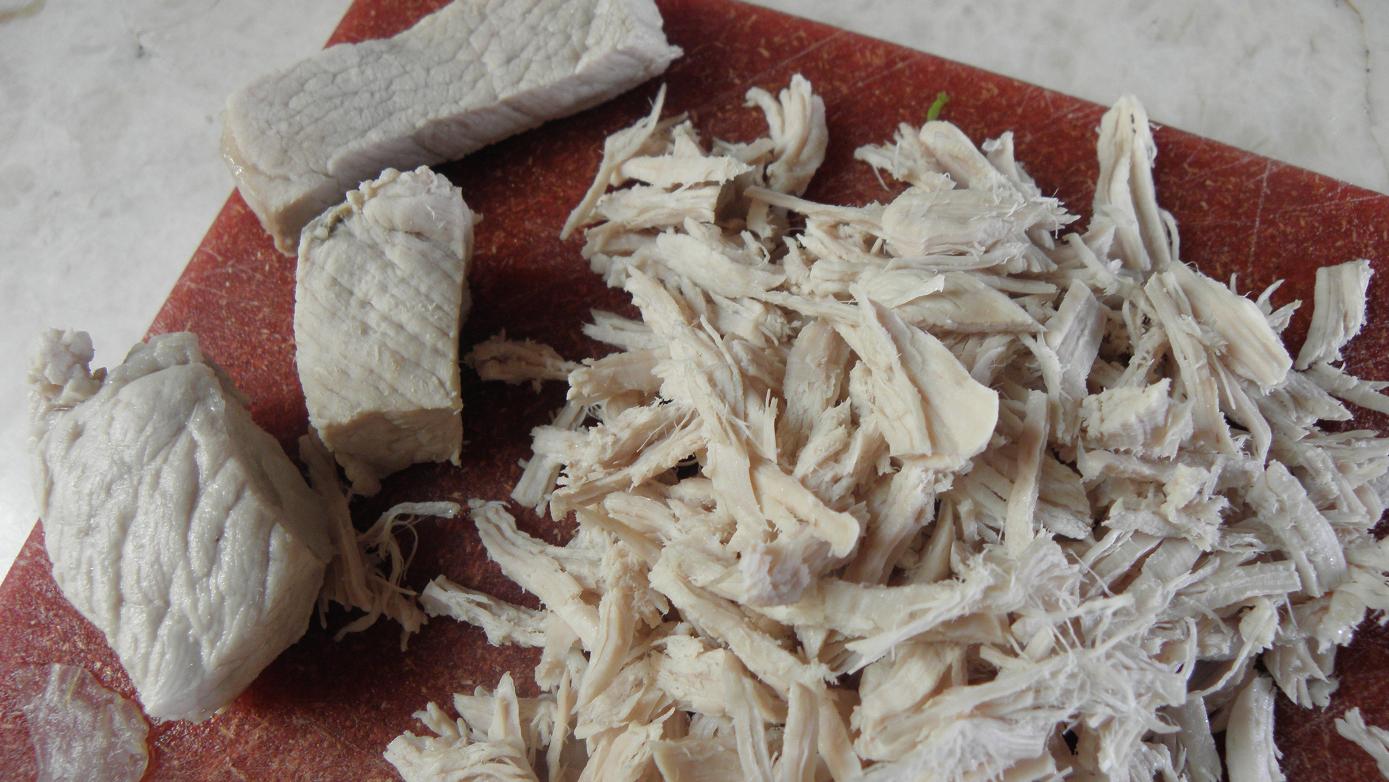 Pulling the cooked pork