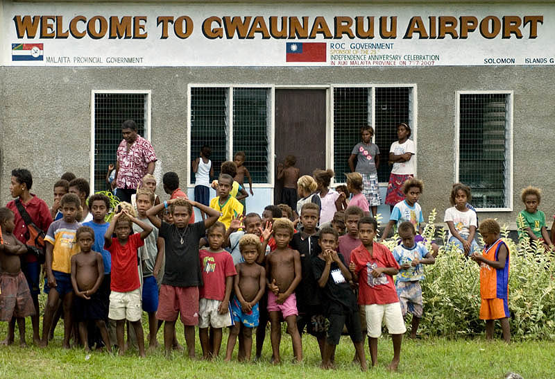 Children gathered at Auki airstrip