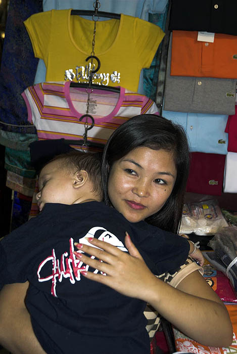 Night Bazaar vendor with her child, Chiang Mai