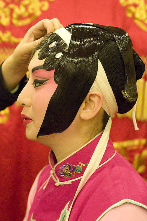 Chinese opera performer preparing
