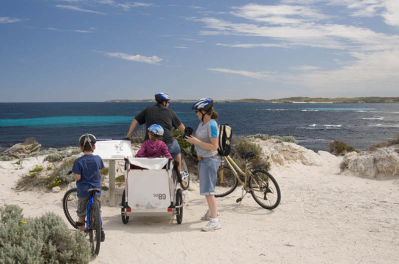 Family cyclists pause at Little Salmon Bay