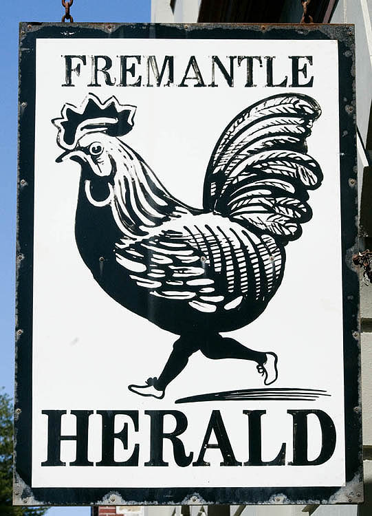 Local newspaper sign