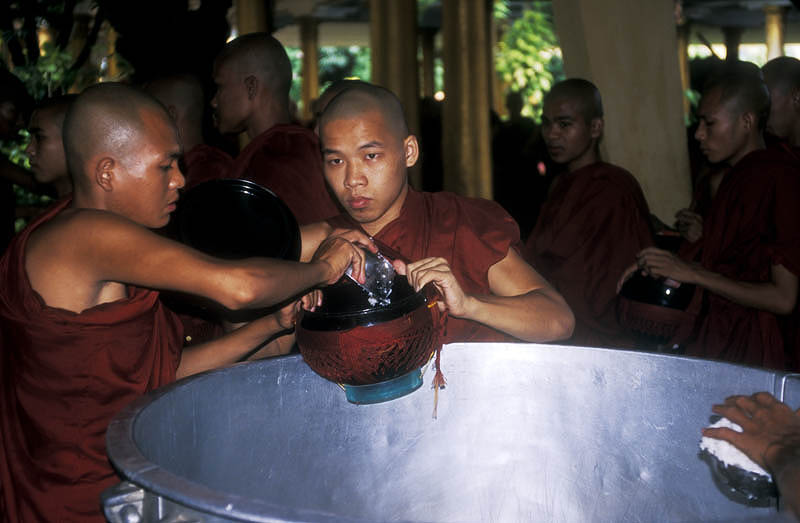 Serving rice into each monk's personal bowl
