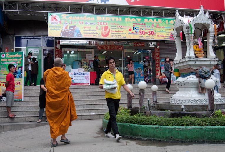 Shopping centre: note the shrine and the monk