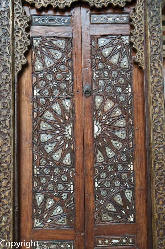 Madrassa Al Ashraf Barsbey - detail of a carved and inlaid door.