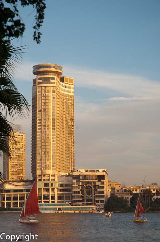 Feluccas passing the Grand Hyatt Hotel on the Nile at Cairo