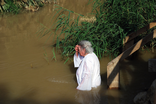 Old lady baptizes herself.