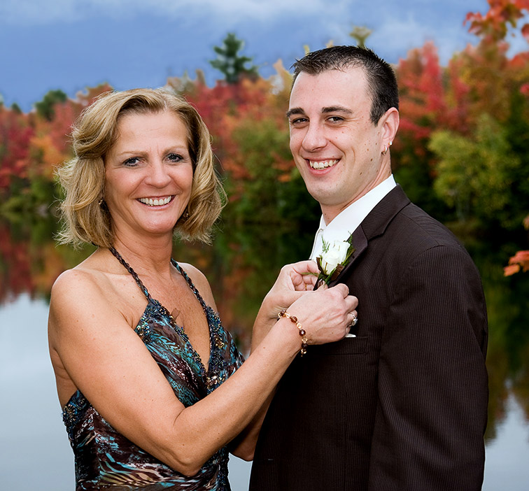 Mom Adjusts Grooms Boutonniere