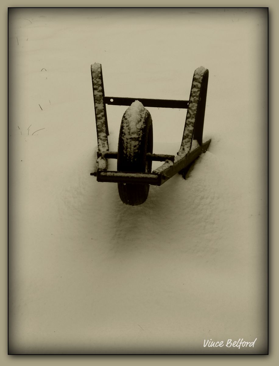 Wheel Barrow In The Snow