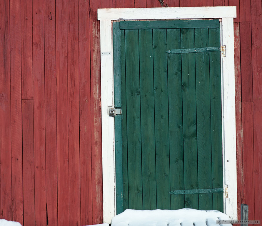 Green door on a red wall
