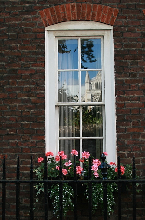 Westminster Cathedral reflected in the window.