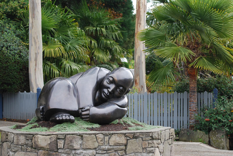 Statue and palm trees