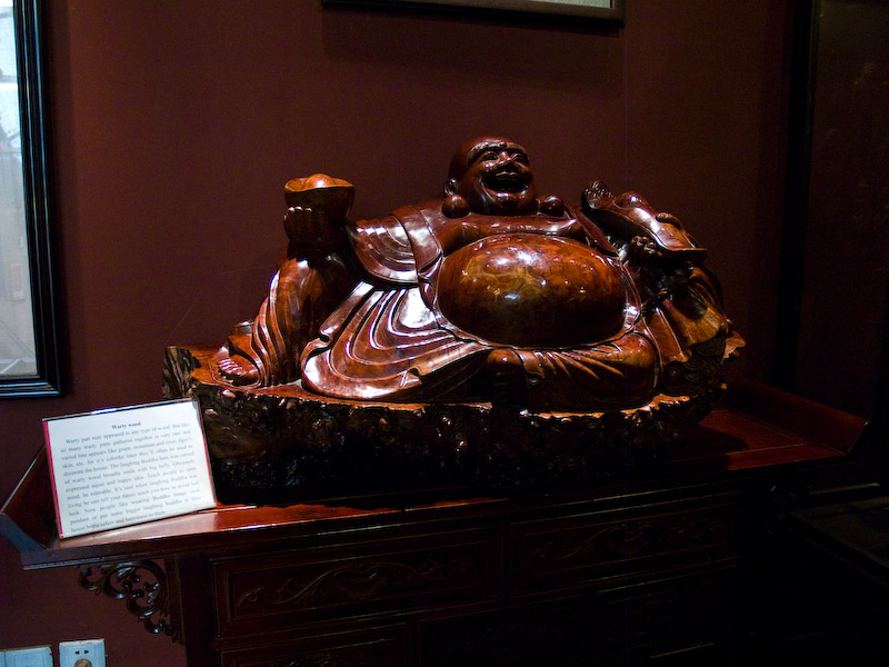 Jade Buddha Temple - Laughing Buddha carved in warty wood