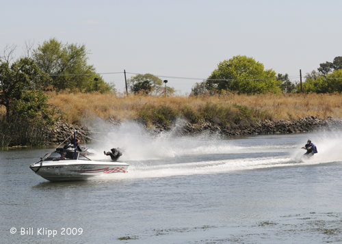 Mike Temby as Batman leaping from Waverunner  1