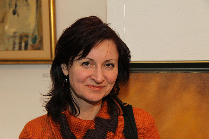Portrait among paintings