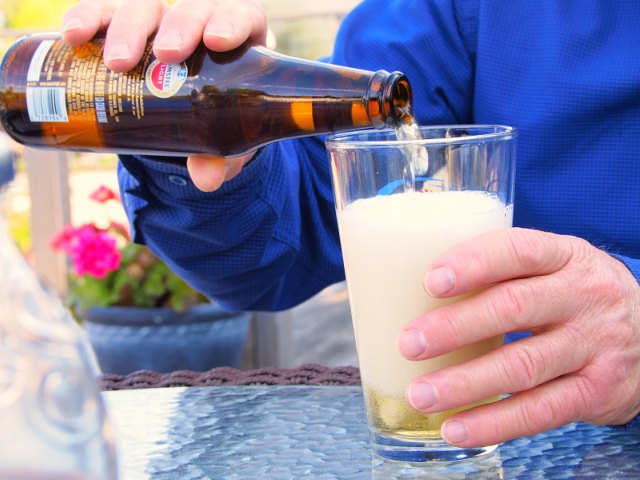 Martin pours a beer.