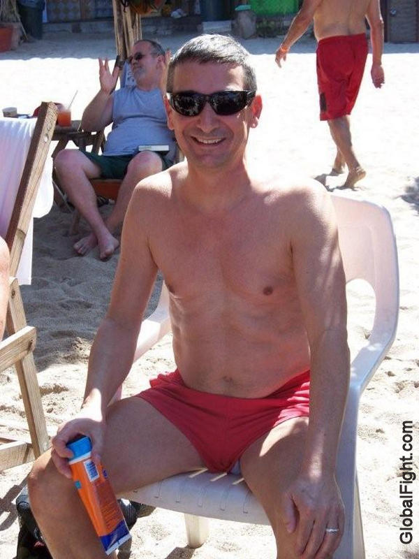 hot boy sitting on chair beach lounging suntanning.jpg