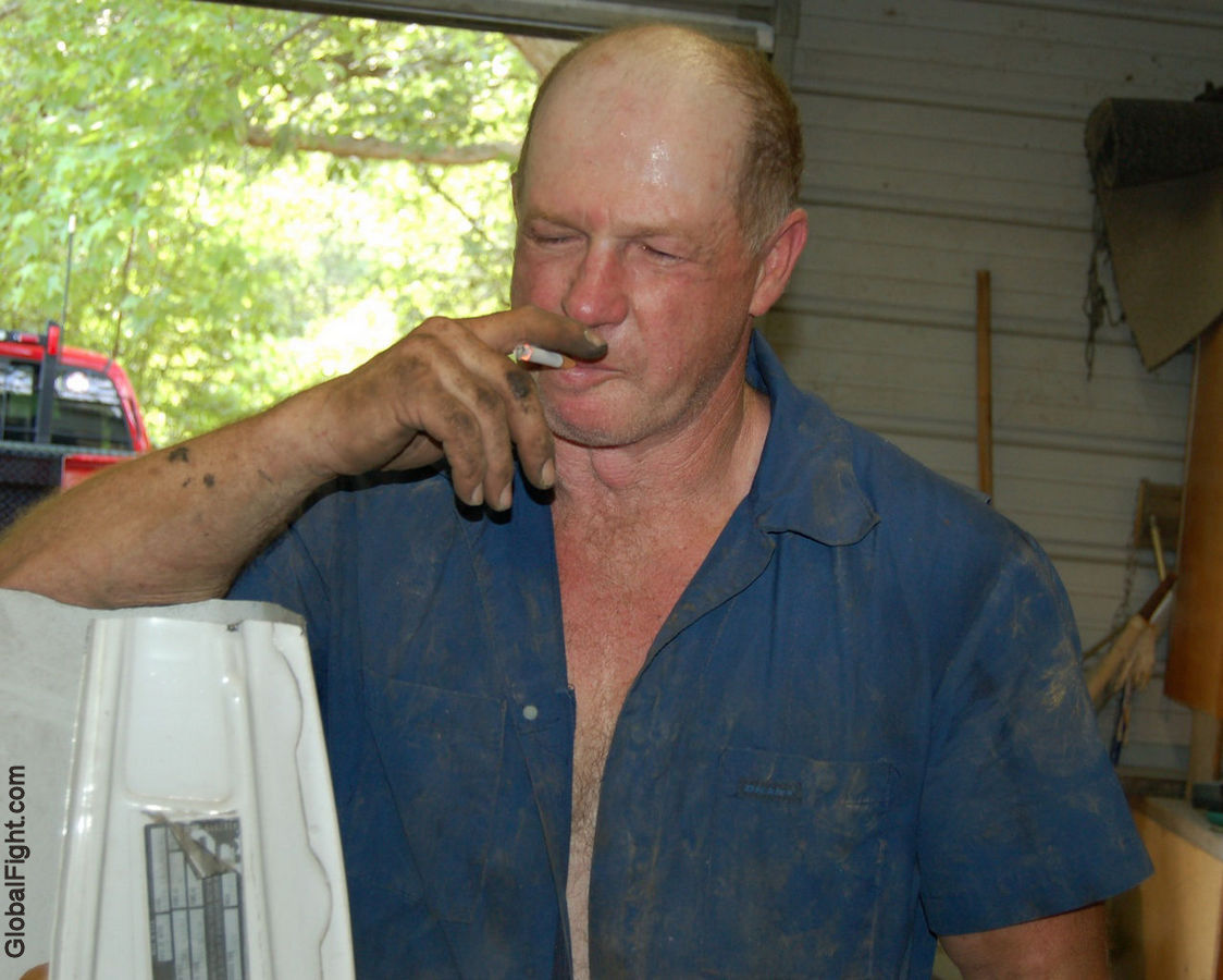 mechanic man smoking overalls dirty guy.jpg