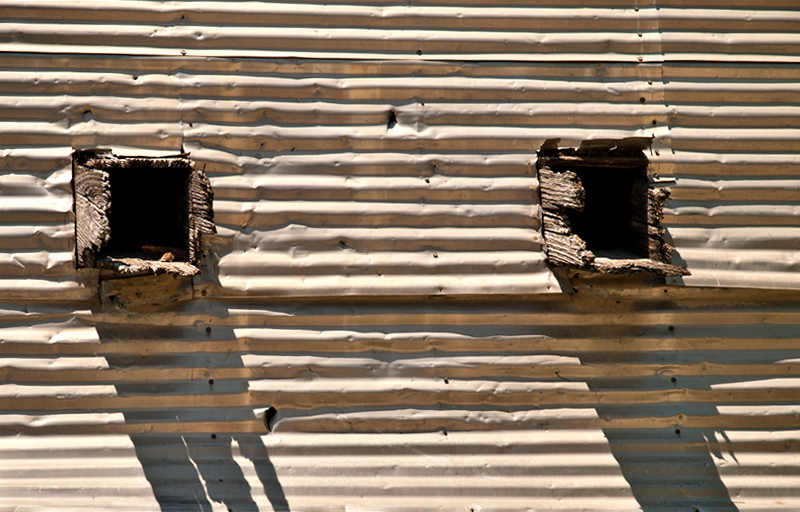 Tin wall with wood holes