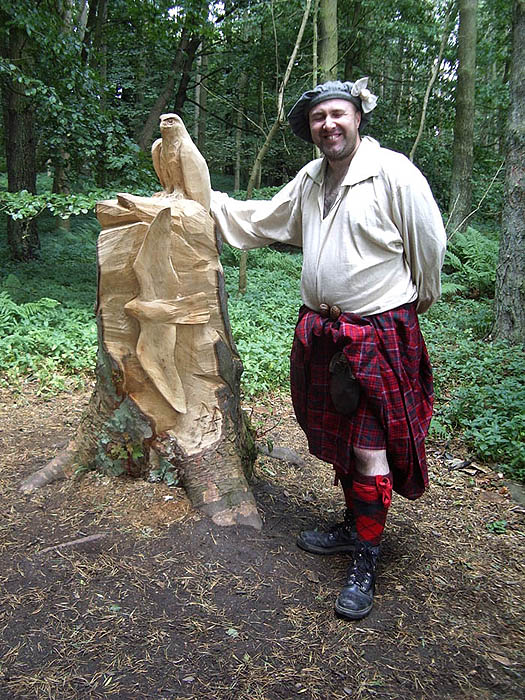 Traditional Scots storyteller with wood carving