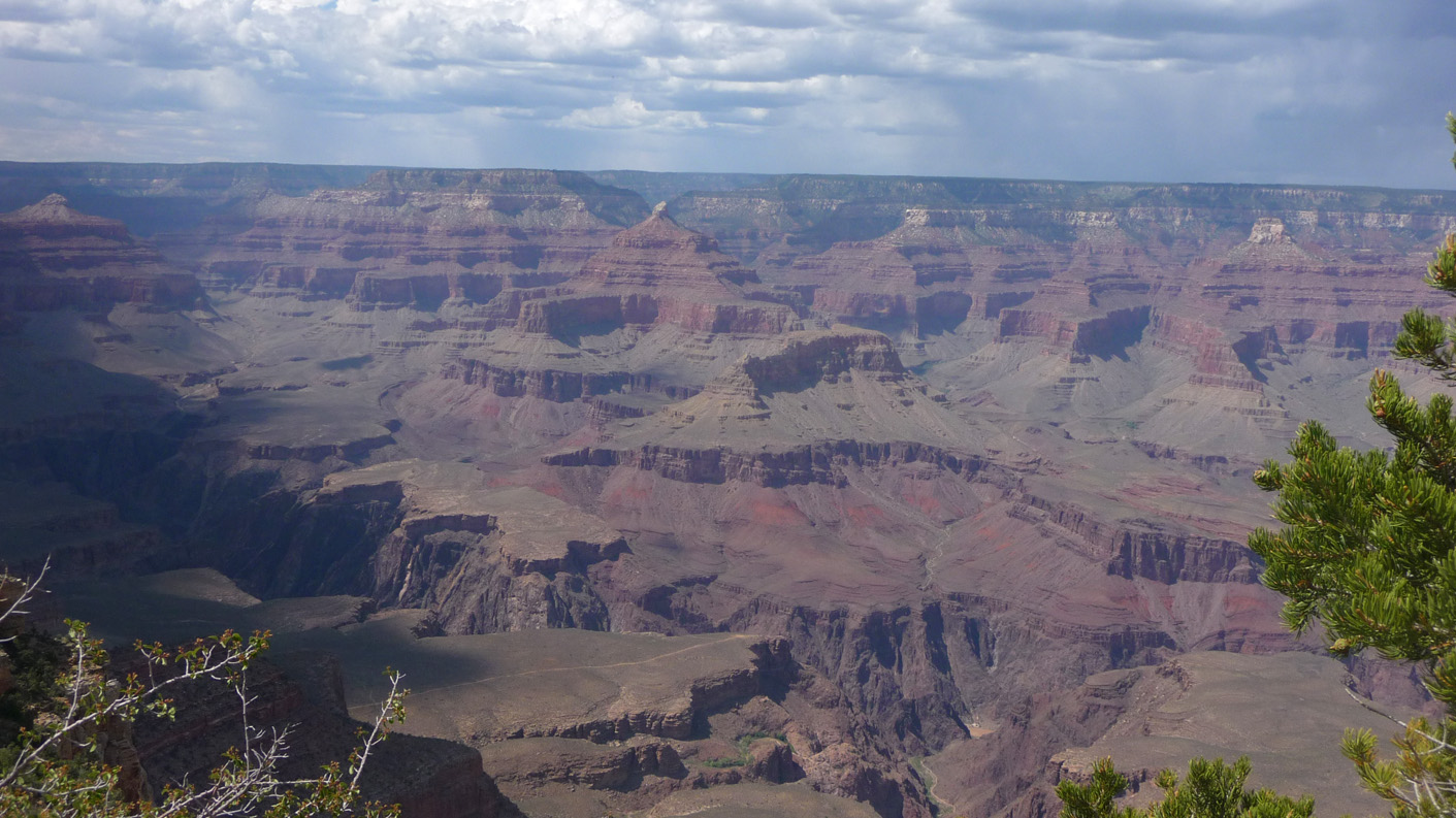 The canyon is 277 miles (446 km.) long, ranges in width from 4 to 18 miles (6.4 to 29 km.) and attains a depth of over a mile.