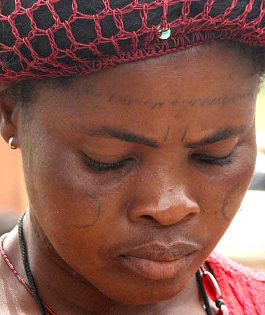 Lady with tattoos in Benin.