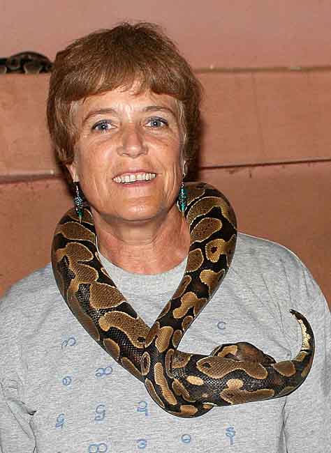 Voodoo. The photographer with a sacred python.