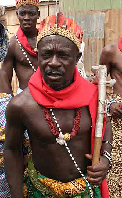 Voodoo priest leading a religious procession.