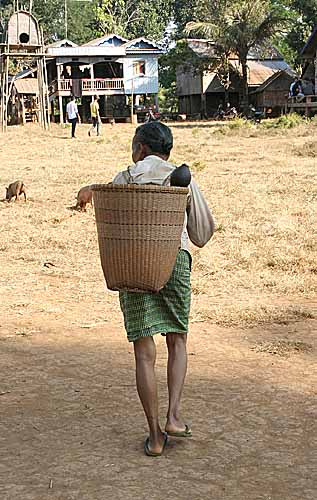 Woman with traditional basket in Nong Leg village, Cambodia.